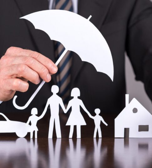 Man Holding An Umbrella Protecting A Family A House And